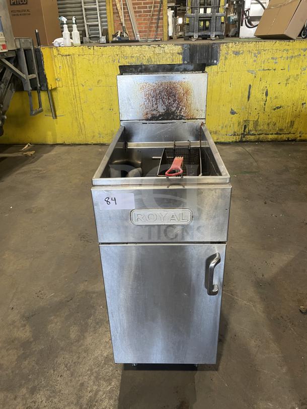 Royal commercial stainless steel natural gas floor fryer with backsplash, 1 basket, on casters; used condition.