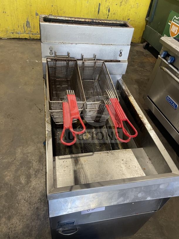 Pitco Frialator commercial stainless steel deep fat fryer with backsplash, basket hanger, and fry basket; natural gas powered.