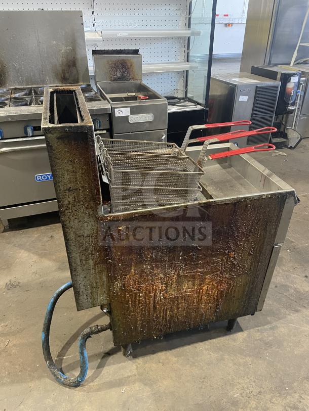 Pitco Frialator commercial stainless steel natural gas fryer with back splash, basket hanger, and fry basket. On legs, used condition.