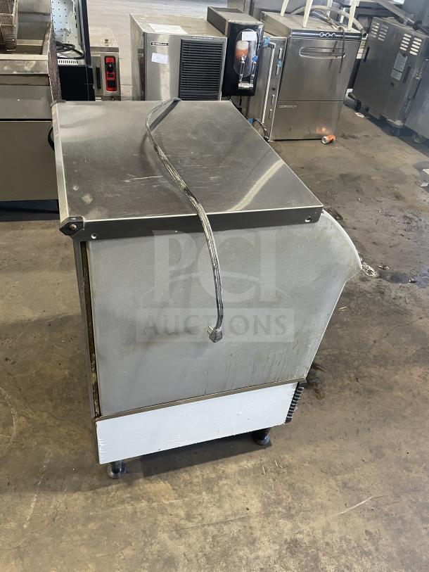 Ice O-Matic commercial ice machine, model ICEU220HA3, 115V, on legs, used condition, visible wear, power cord attached.