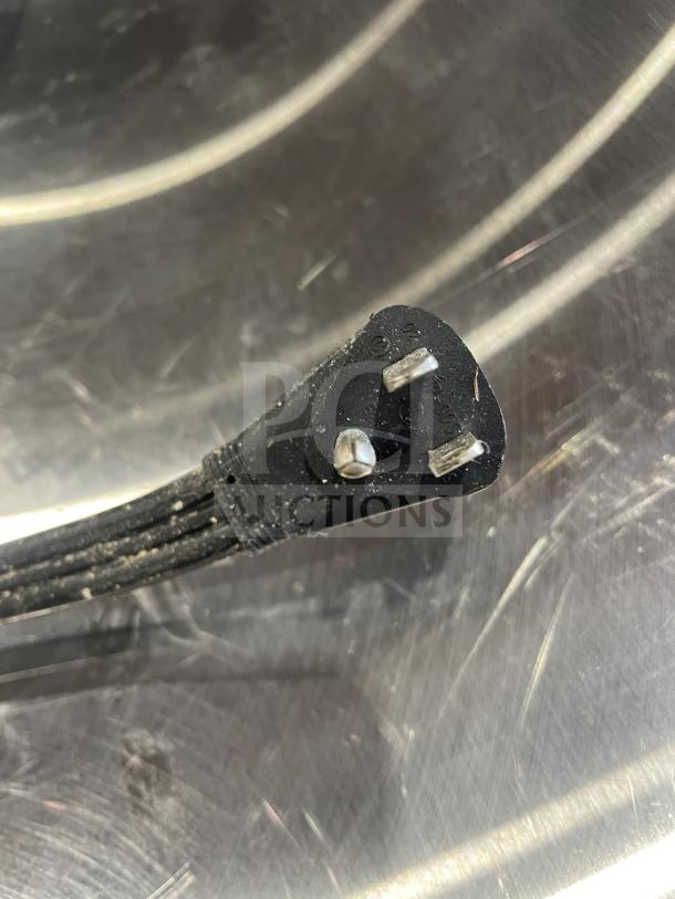 Power cord plug for Ice O-Matic commercial ice machine, model ICEU220HA3. Three-prong design, shown in detail.