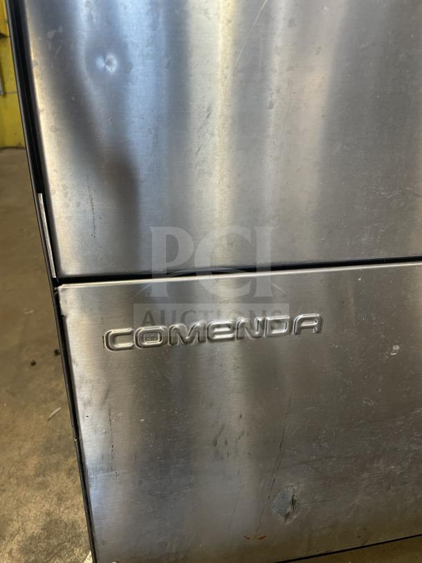 Comenda Commercial Series stainless steel undercounter dishwasher, visible brand logo, minor surface scuffs, SN: GS0018690315.