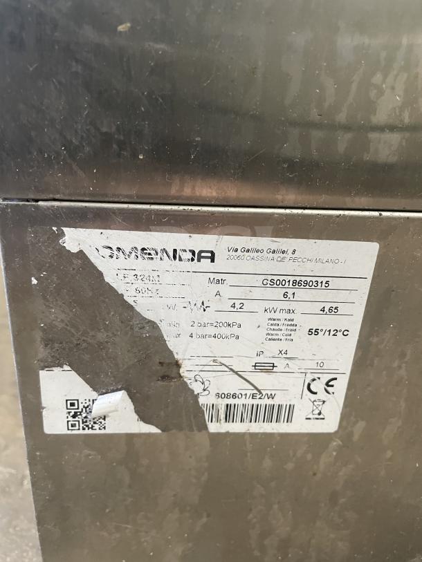 Comenda stainless steel undercounter dishwasher, Commercial Series, SN: GS0018690315. Features visible label with specs.