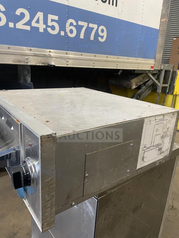 Viking stainless steel commercial electric warming drawer with knob control, minor wear, suitable for professional kitchens.