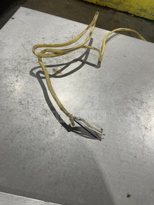 Viking stainless steel commercial electric warming drawer with visible power cable. Used condition, minor surface wear.