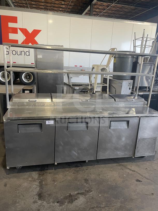 True TTP-93 3-door stainless steel pizza prep table, on casters, good condition. 115V, 1-phase, serial 1-2827290.
