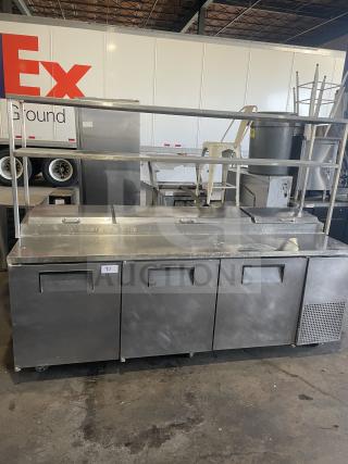 True TTP-93 3-door stainless steel pizza prep table, on casters, good condition. 115V, 1-phase, serial 1-2827290.