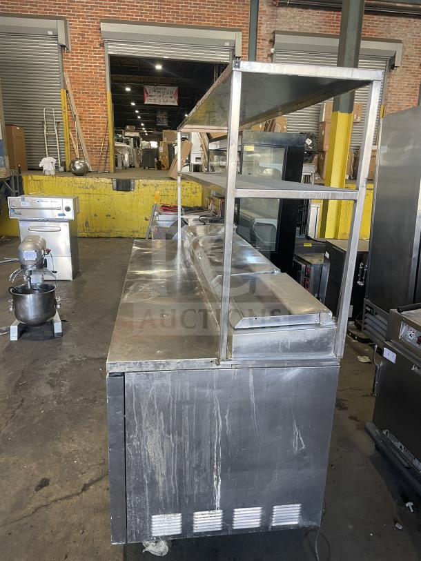 True TTP-93 stainless steel 3-door refrigerated pizza prep table with casters, fair condition, 115V, 1 phase.