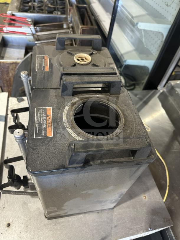 Bunn SH SERVER commercial stainless steel dual coffee server. Model: SH SERVER, SN: TS00682244. Used condition with visible markings.