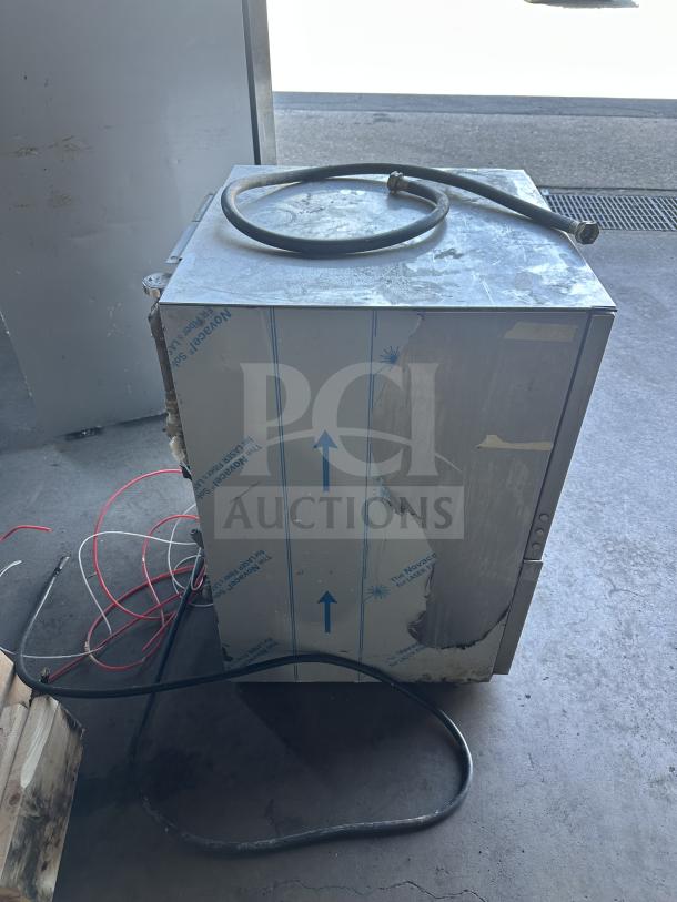 Jackson DishStarHT commercial dishwasher, stainless steel, model DISHSTARHT-E, used, visible cords, and full-size peg rack.