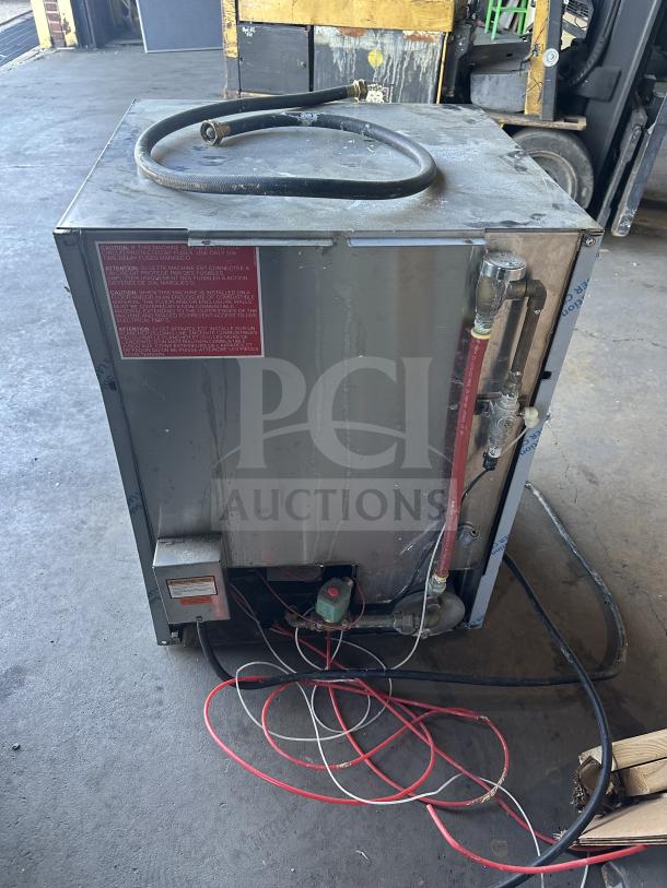 Jackson DishStar Series commercial undercounter dishwasher, stainless steel, electric, model DISHSTARHT, with full-size peg rack, 208-230V, in good condition, with visible red warning label.