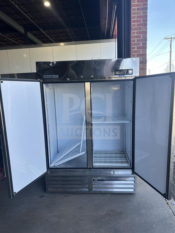 Beverage Air stainless steel commercial reach-in freezer, model KF48-1AS. Dual doors open, white interior, 115V, 1 phase.