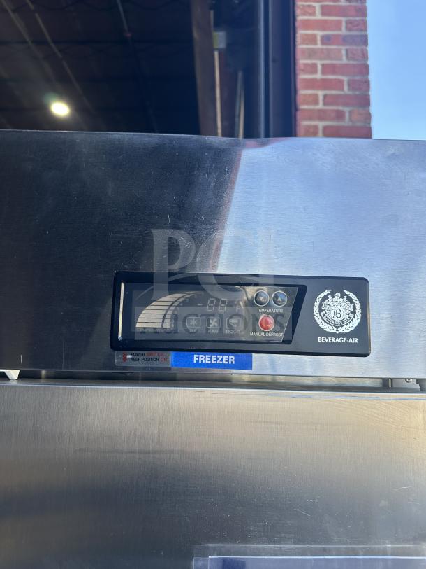 Beverage Air KF48-1AS commercial stainless steel two-door freezer. Features digital display, power switch, and "FREEZER" label.