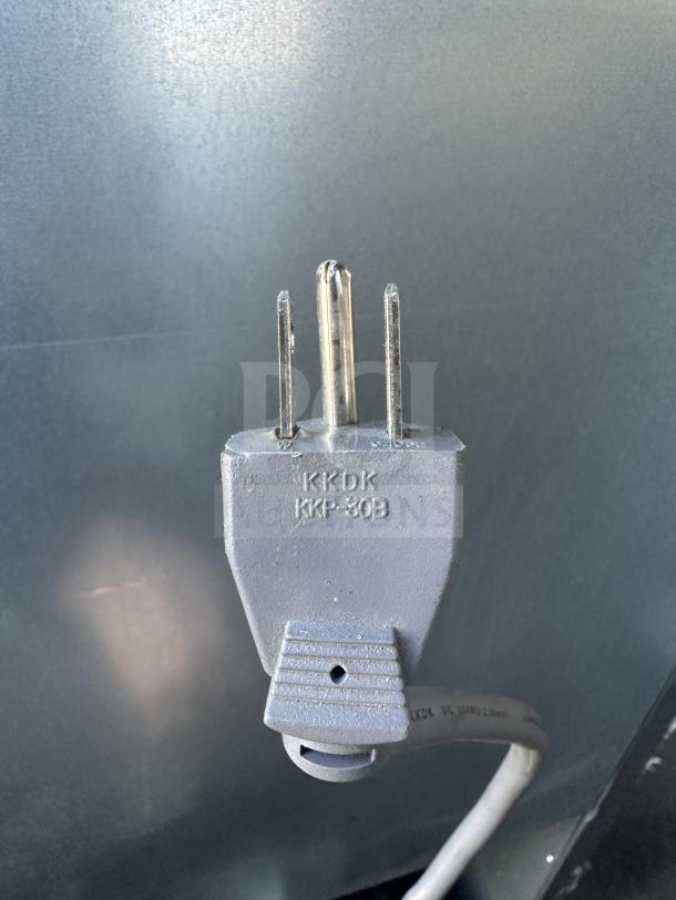 Close-up of the power plug for Beverage Air KF48-1AS commercial reach-in unit. Plug labeled "KKDK KKP-30B".