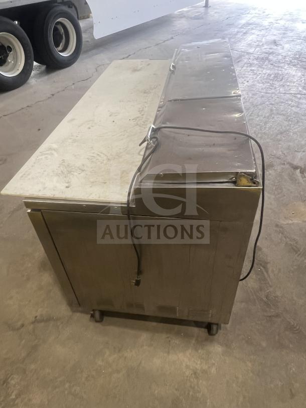 True Commercial Stainless Steel 2-Drawer Refrigerated Chef Base, Model 1RE-PT-HD, on casters with oversized worktop.