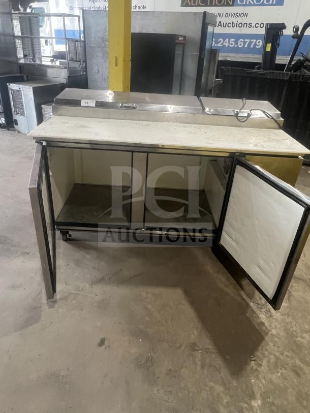 True commercial stainless steel 2-drawer refrigerated chef base with oversized worktop, model 1RE-PT-HD, on casters.