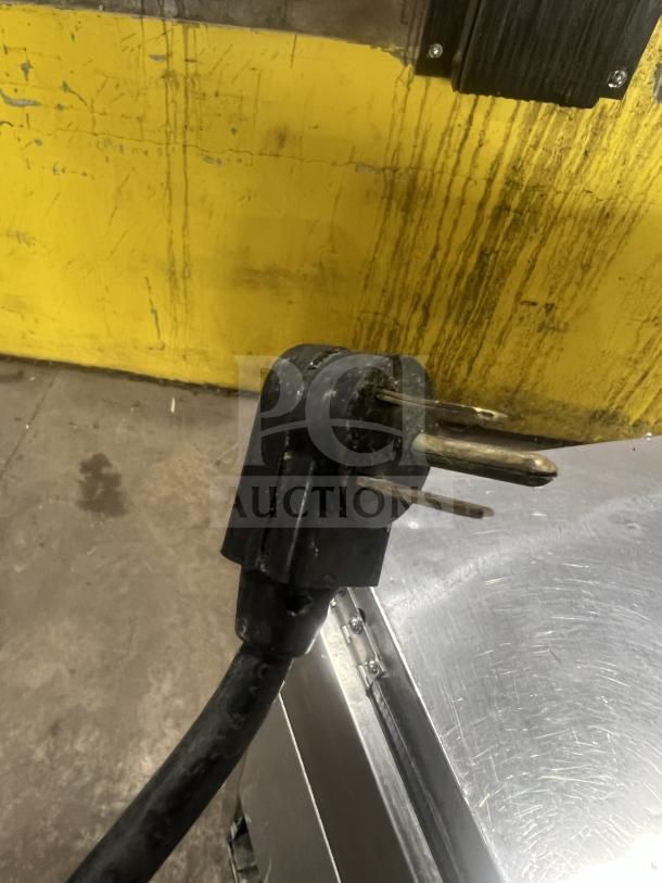 True commercial stainless steel chef base, 2-drawer model 1REPTHD, featuring oversized worktop, shown with power cord.