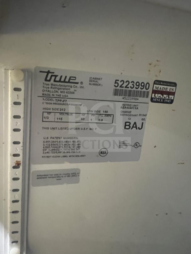 True Commercial Stainless Steel 2 Drawer Refrigerated Chef Base, Model TTP-67, SN: 5223990, NSF certified, on casters.