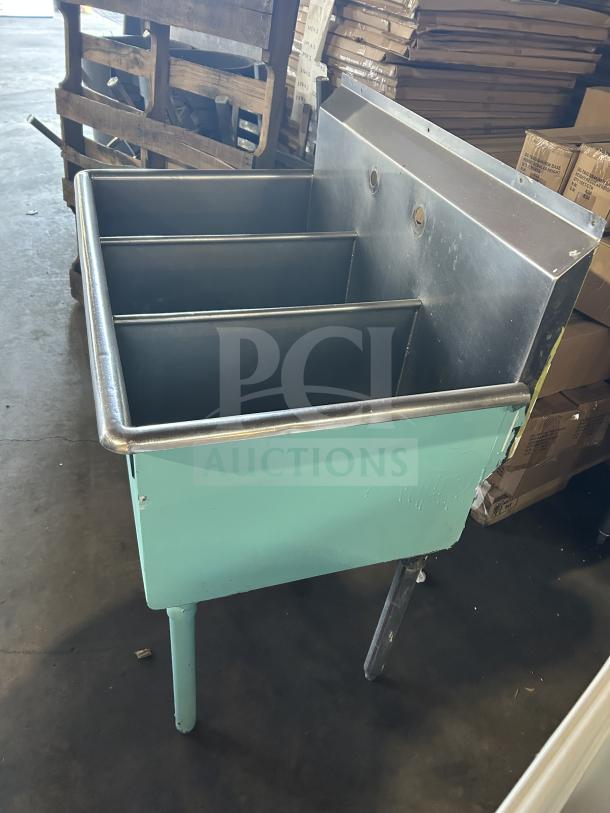 Commercial stainless steel teal 3-compartment bar sink on legs, featuring a backsplash and sturdy build, ideal for bars.