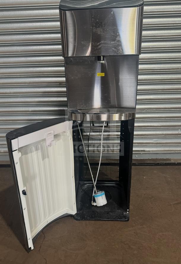 Brio CLBL720SC electric water dispenser, stainless steel, open compartment, visible power cord, model SN:2207010250, 115V.