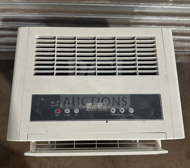 Friedrich D50BP dehumidifier on casters, controls panel visible, model and SN noted, slightly worn. 115V, efficient design.