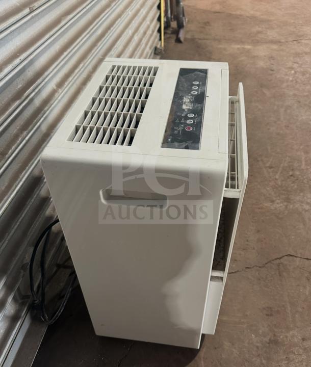 Friedrich D50BP dehumidifier on casters, 115V, SN: AFAD00983, white, good condition with user control panel on top.