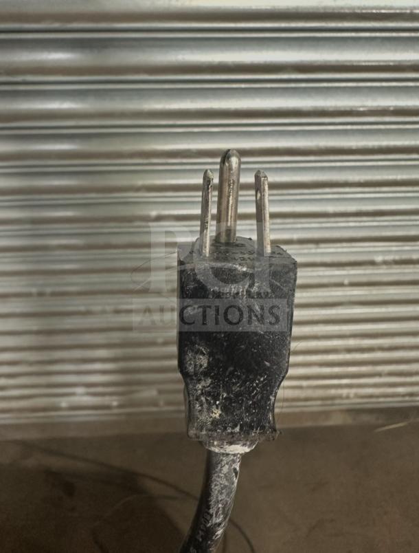 Power plug of a Friedrich D50BP dehumidifier, model D50BP. Visible wear; suitable for 115V use.