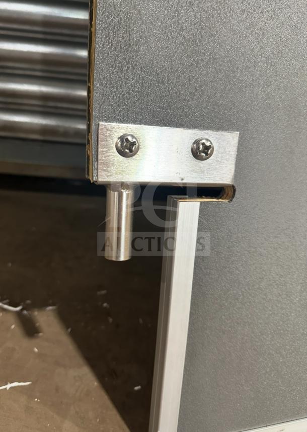 Impacdor refrigerator door hinge close-up, stainless steel, in excellent condition. Model SN:830160 visible.