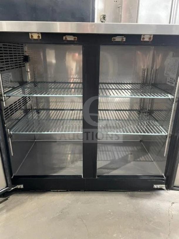 Kelvinator Commercial 2 Door 48" Black Back Bar Refrigerator, stainless steel worktop, poly coated wire racks, model KCBB48SBHC, excellent condition.