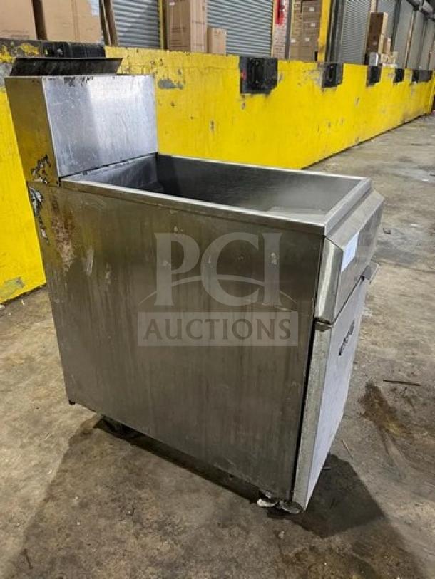 Asber AEF-4050-S-E-NG stainless steel deep fat fryer, natural gas, 40/50 lb capacity, with backsplash, on casters, used condition.