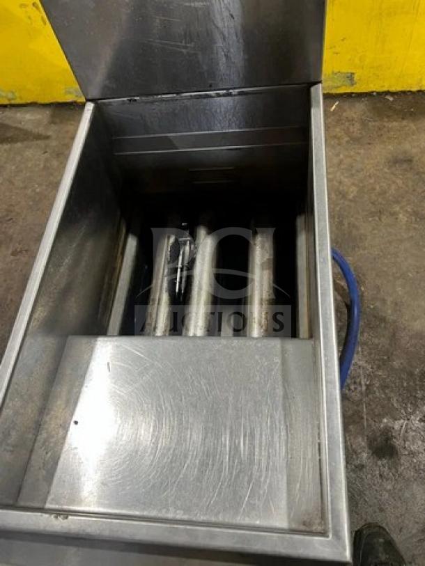 Asber AEF40/50 stainless steel natural gas deep fryer, 40/50 lb capacity, with back splash, on casters, used condition.