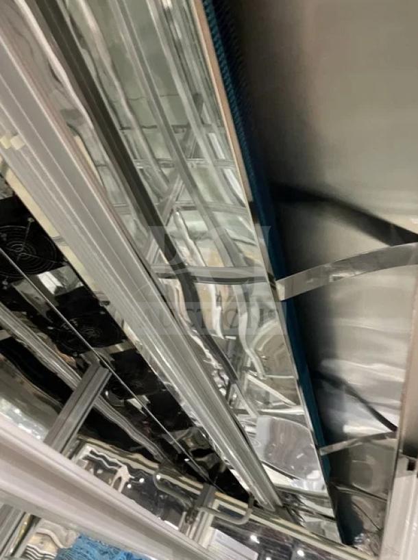 Commercial white multi-tier refrigerated bakery merchandiser, model ZSG-LLQ18, with double glass sliding doors, 220V.