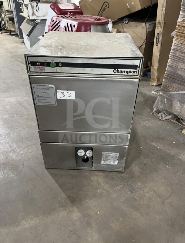 Champion commercial stainless steel undercounter dishwasher, visible panel gauges, light surface wear, model label intact.
