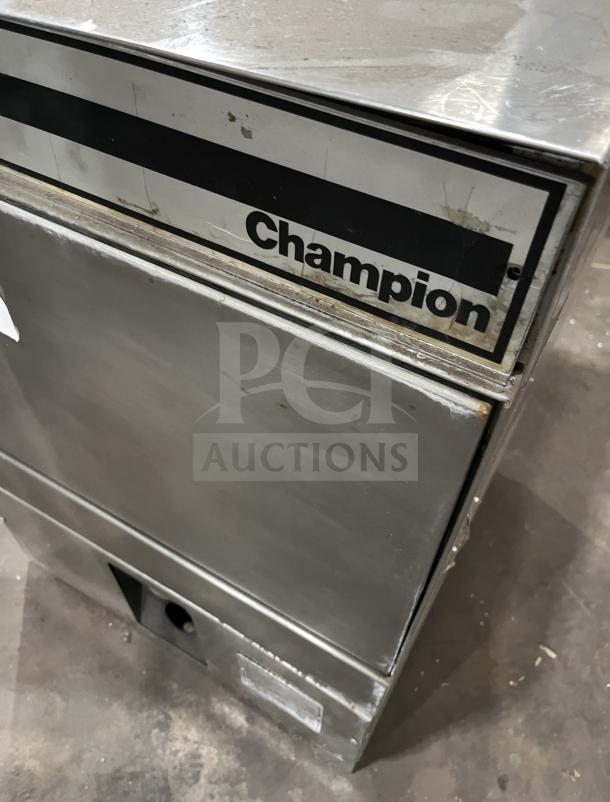 Champion commercial undercounter dishwasher, stainless steel, visible wear, branded tag, ideal for professional kitchens.