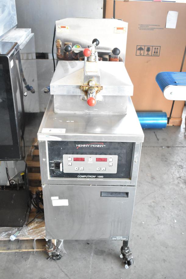 2025 Henny Penny 600 pressure fryer, natural gas, 80,000 BTU, on commercial casters, good condition, visible control panel.