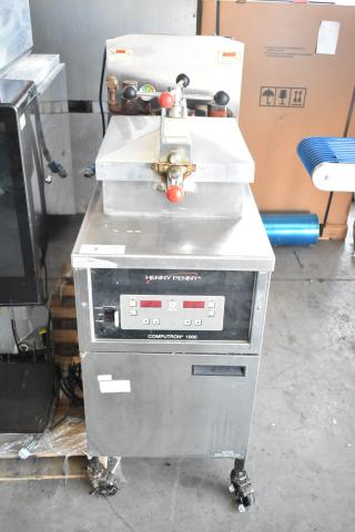 2025 Henny Penny 600 pressure fryer, natural gas, 80,000 BTU, on commercial casters, good condition, visible control panel.