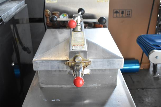 2025 Henny Penny 600 pressure fryer on casters, natural gas, 80,000 BTU, commercial use, visible handle and control labeling.