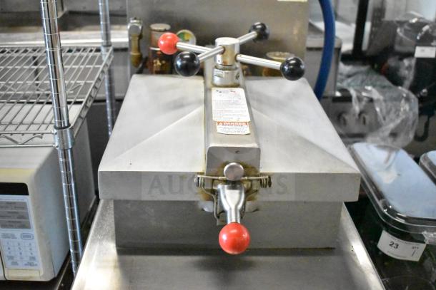 2023 Henny Penny 600 pressure fryer, natural gas, 80,000 BTU, on commercial casters. Visible labels include safety warnings.