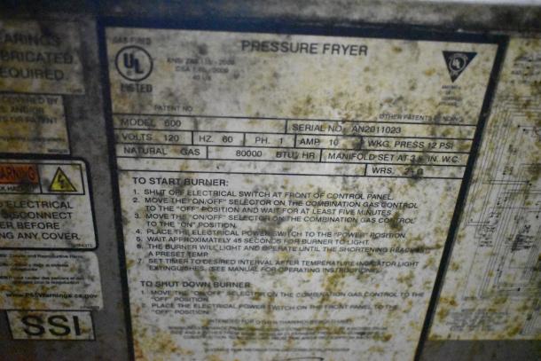 2023 Henny Penny 600 Pressure Fryer, 80,000 BTU, natural gas, model label with usage instructions, commercial casters.
