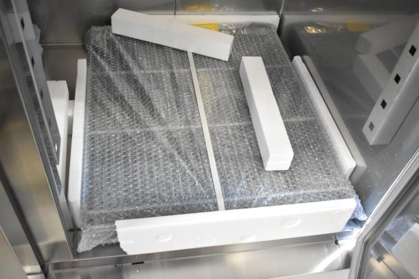 Brand new Avantco 178SS3RHC commercial 3-door cooler, 115 volts, scratch and dent, shown with packaging materials.