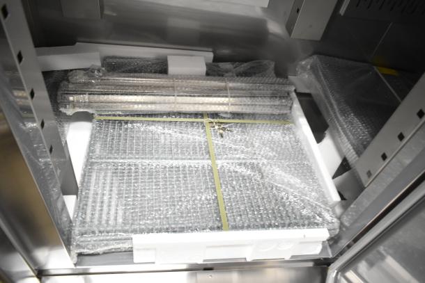 Brand new 2025 Avantco 178SS3FHC commercial 3-door reach-in freezer, 115 volts, shown with packaging and minor scratches.