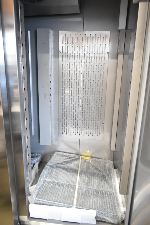 Brand new Avantco 178SS3FHC commercial 3-door reach-in freezer interior view. Scratch and dent condition, with protective packaging.