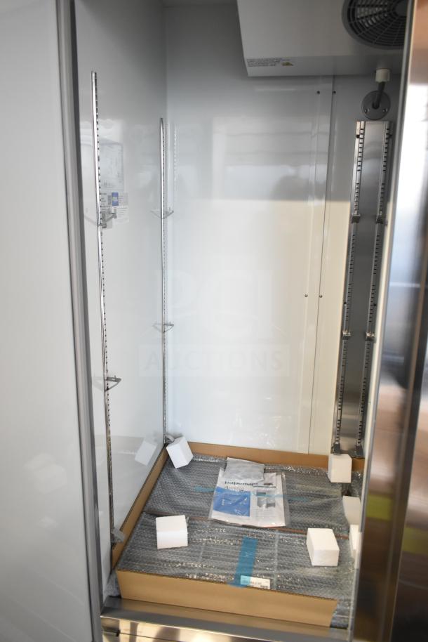 Brand new Avantco 178A49RHC 2 Door Reach In Cooler, 115V, 1 Phase, with visible packaging materials inside.