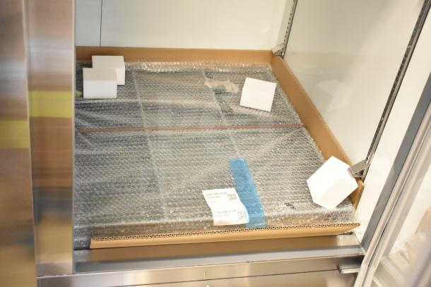 Brand new Avantco 178A49RHC commercial 2 door cooler, scratch and dent, 115V, displayed with protective packaging.