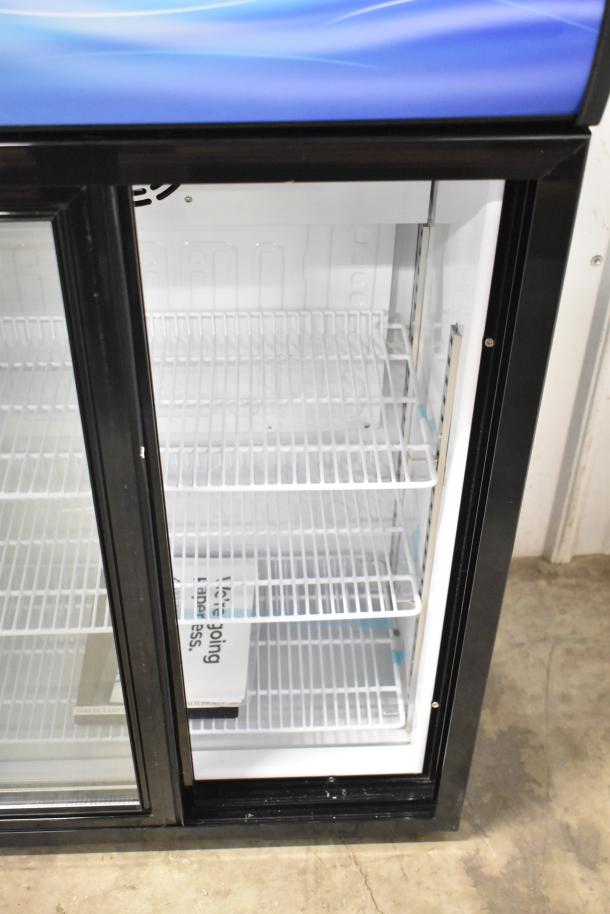 Avantco 360CSM4HCB black countertop display refrigerator, new, with sliding door, merchandising panel, slight cosmetic dents.