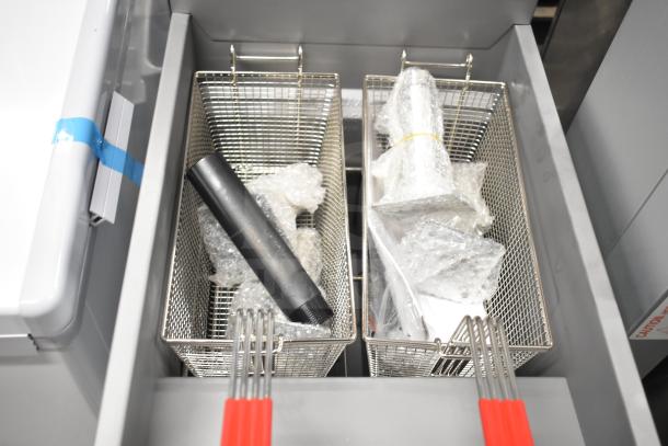 Mainstreet 541FF50N commercial fryer with twin baskets and packaging materials. Scratch and dent condition, 120,000 BTU.