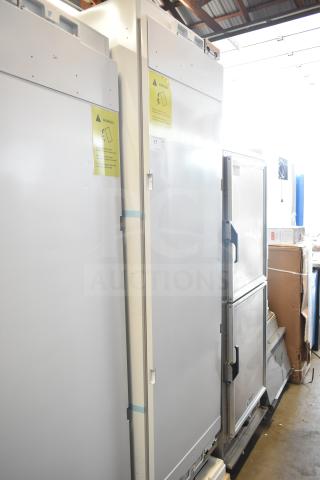 Brand new, 115V single door reach-in cooler. Scratch and dent condition. Includes warning labels and handle detail.