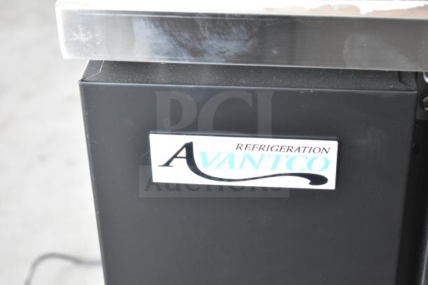 Brand new Avantco 178UBB48HC 48" black counter height back bar refrigerator with LED lighting, showing logo detail.