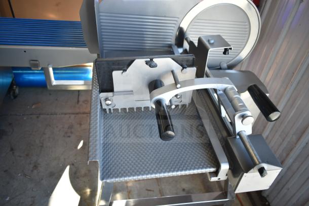 Jaccard Conveyor commercial floor-style meat slicer stacker, 115 volts, 1 phase; stainless steel build, excellent condition.