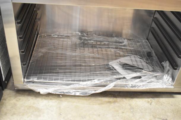 Brand new 2024 Avantco 177CHSME32IM 32" electric countertop cheese melter, visible protective plastic wrap, 208/240V, with grid rack.